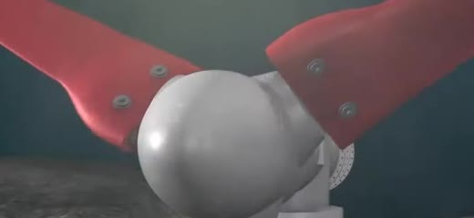 A tidal turbine rotor with red blades on a white hub.