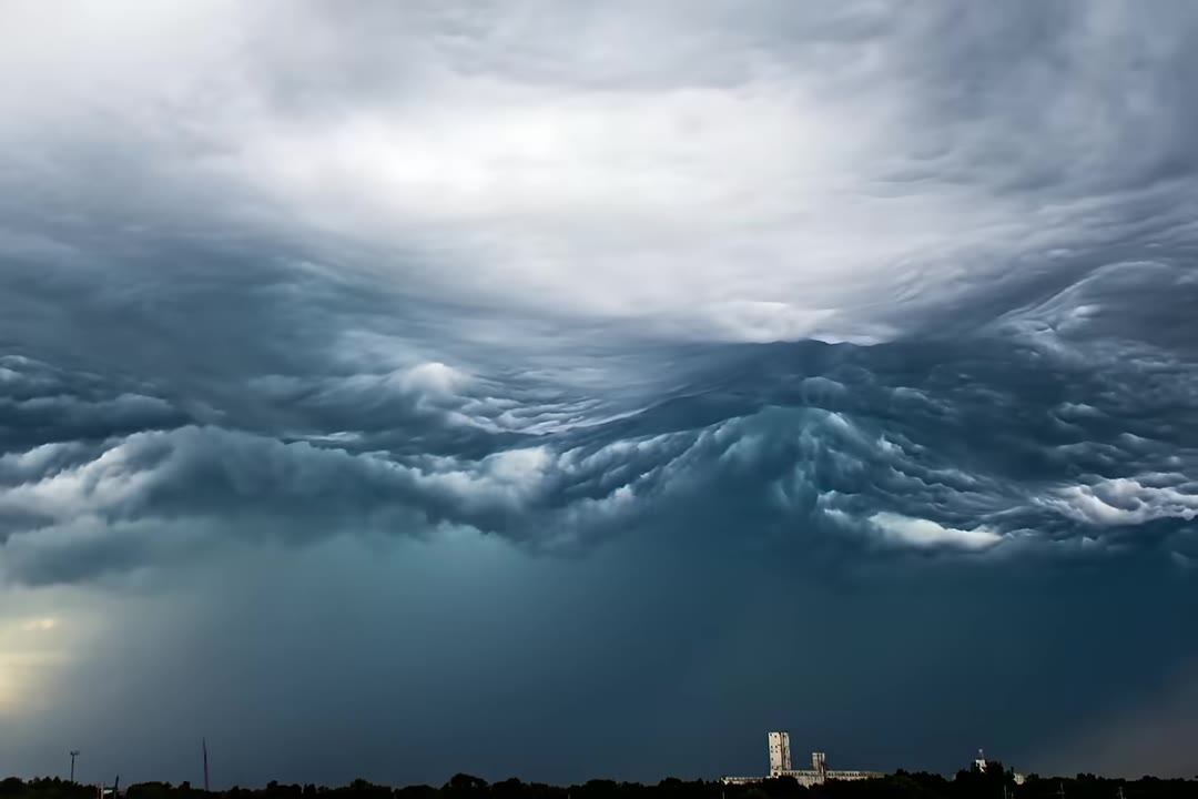 Undulatus asperatus clouds rolling in waves over a skyline
