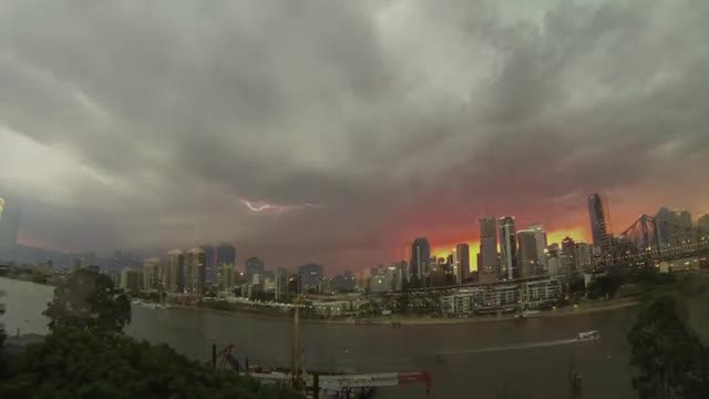 Lightning over the Brisbane skyline at dusk.