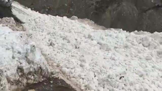 A slope covered in avalanche debris