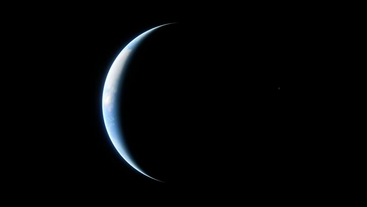Thin crescent of a planet against black space