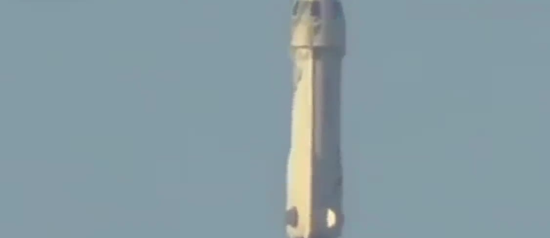 New Shepard booster climbing after liftoff