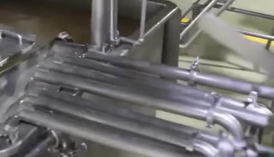 Metal pipes and vats in a processing plant