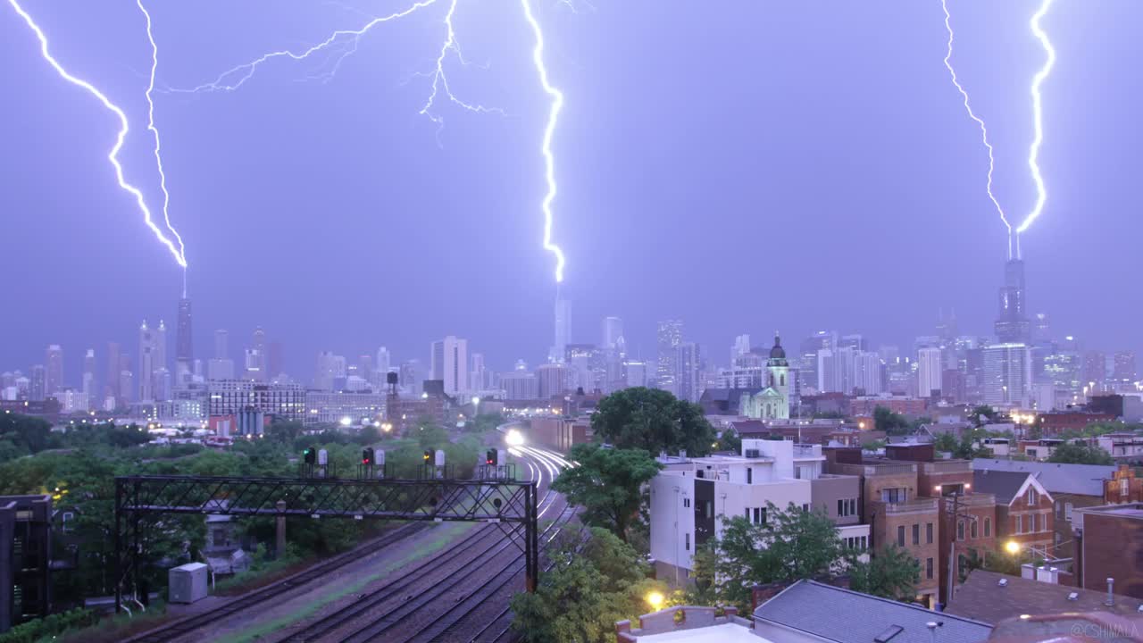Three lightning bolts striking Chicago skyscrapers during the June 30, 2014 storm