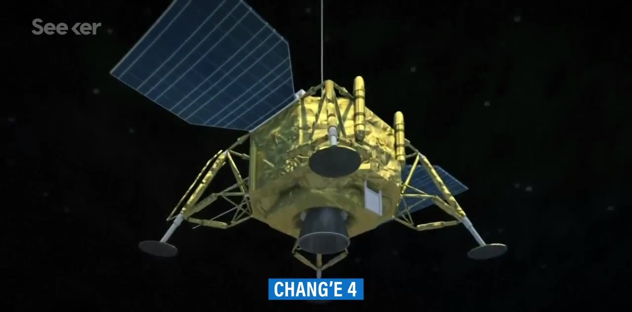 Gold lunar lander spacecraft floating against a starfield