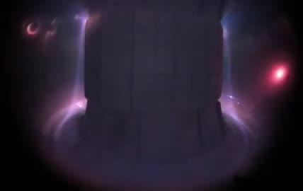 A purple plasma glowing inside a tokamak.