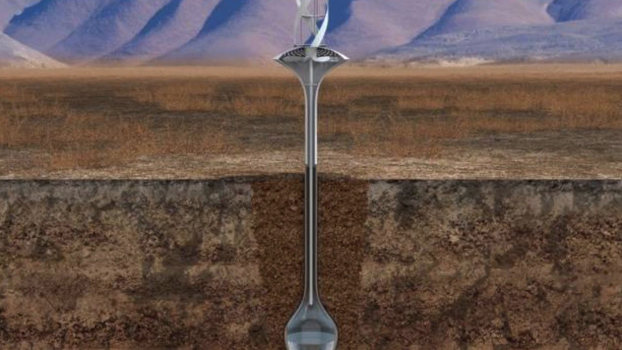 Cutaway render of the WaterSeer: a small wind turbine above ground feeding a pipe down to a condensation bulb buried in the soil.
