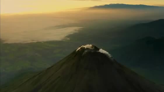 Arenal volcano above green valleys
