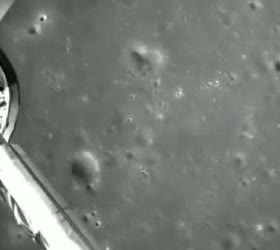 Cratered ground seen during a descent to the far side of the Moon.