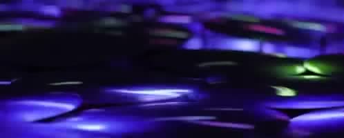 Glowing colored lights in a dark room.