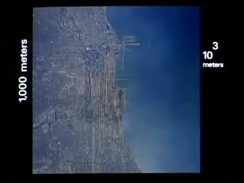 Aerial view of a city coast marked at a 1,000-metre scale