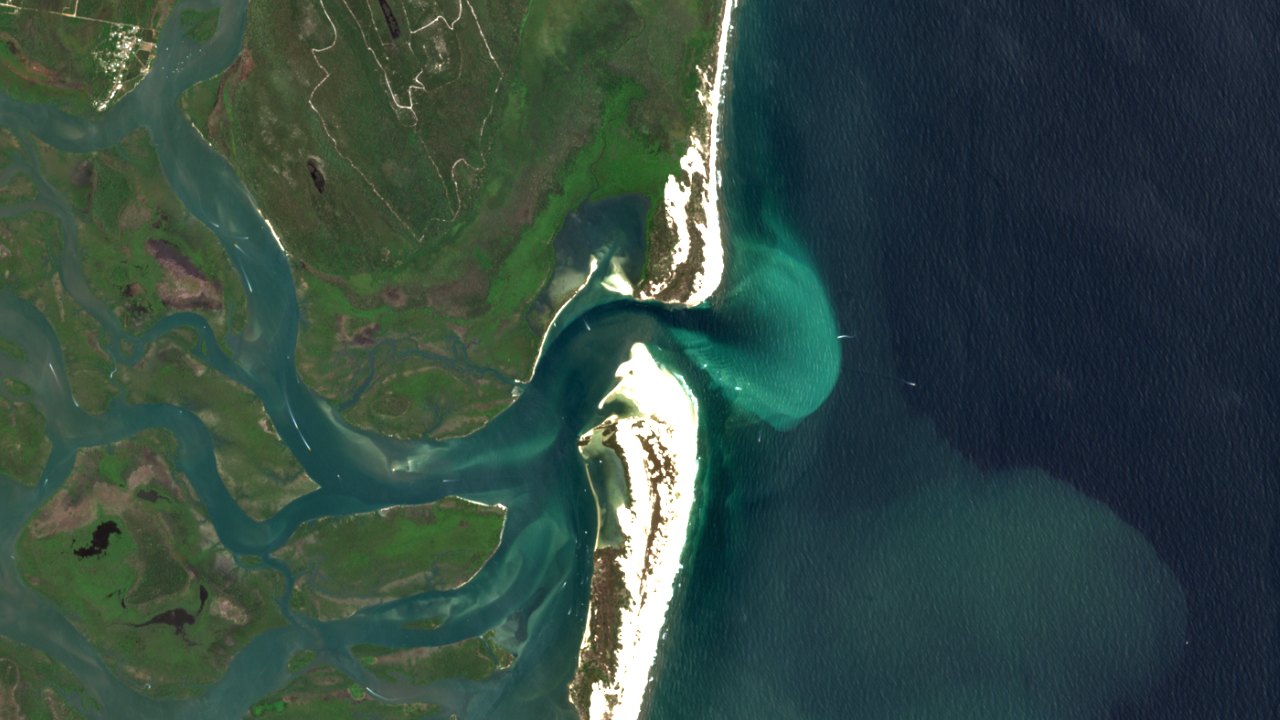 Satellite view of the Jumpinpin channel between North and South Stradbroke Islands, with sandbanks and turquoise tidal water.