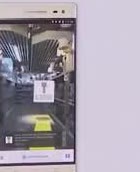 A phone showing an indoor aisle