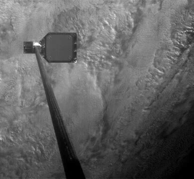 A harpoon striking a piece of orbital debris