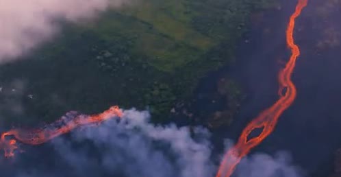 Two bright lava rivers crossing dark ground.