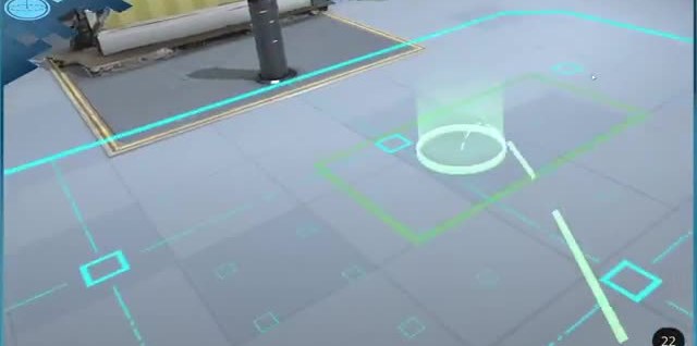 Augmented view of a floor with cyan boxes, a ring, and alignment marks