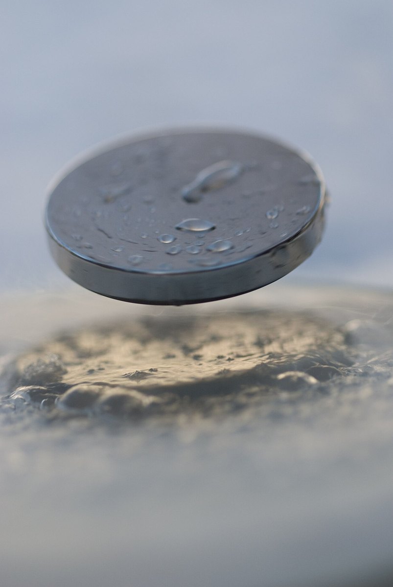 Magnet levitating above a cooled superconductor