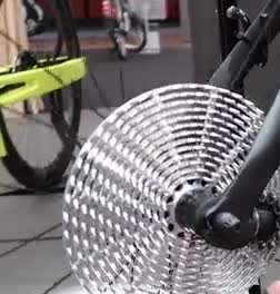 A large toothed disc on a bicycle drivetrain.