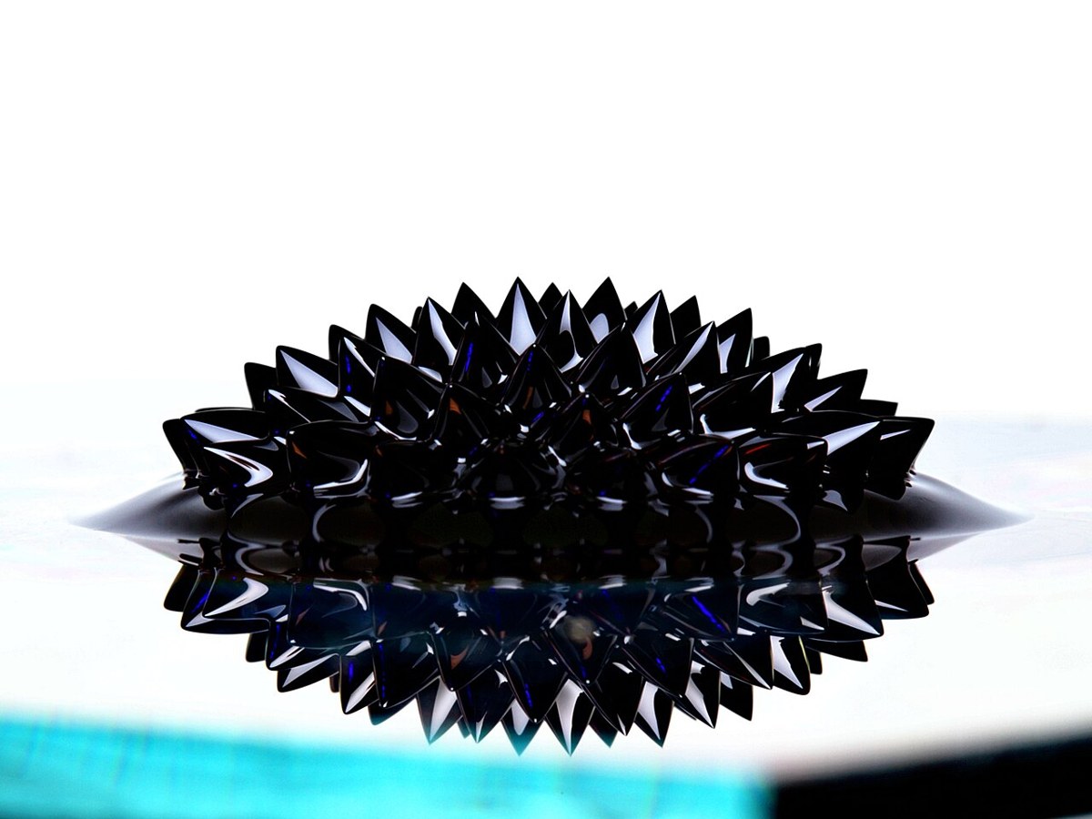 Ferrofluid forming spikes over a magnet