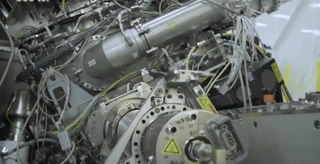A chip-fabrication tool: metal chambers, cables, and a circular flange.