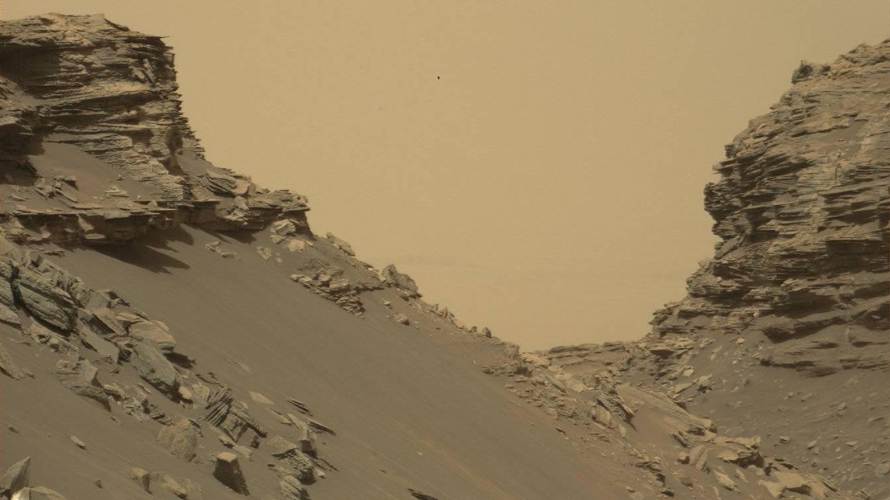 Layered sandstone buttes and slopes in the Murray Buttes region of Mount Sharp on Mars, photographed by the Curiosity rover.