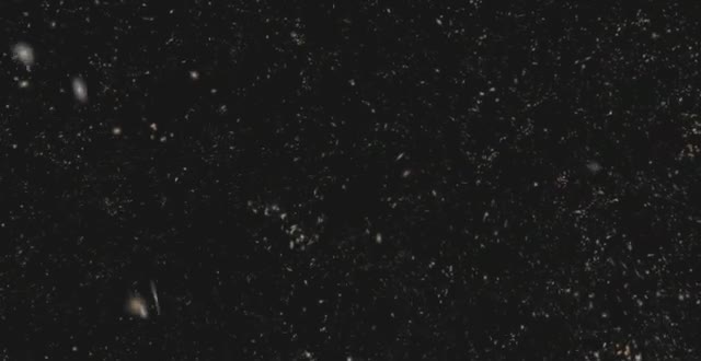 A field of distant galaxies on a black sky