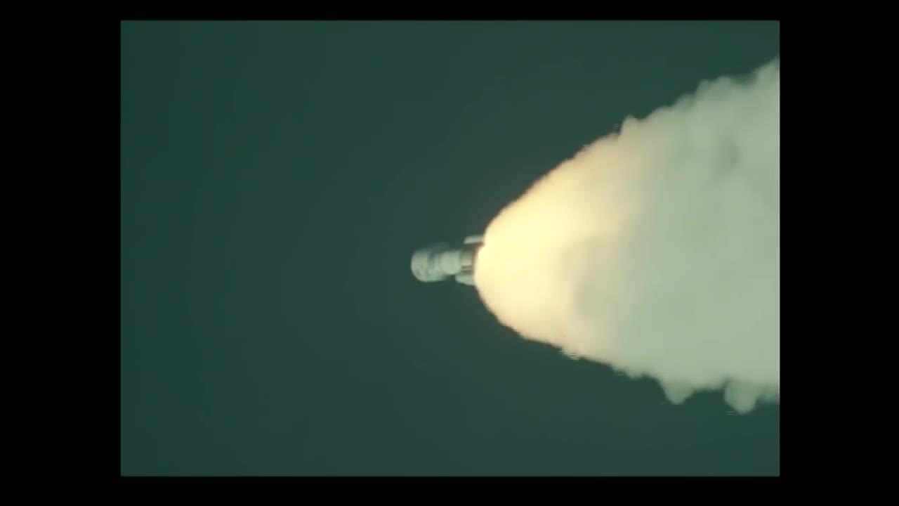 Atlas V climbing inside a bright exhaust plume