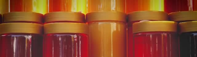 Rows of jars filled with honey