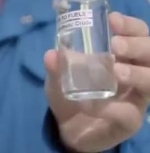 A small bottle of clear synthetic fuel.