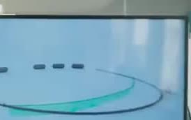 A curved floating boom built to collect ocean plastic