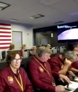 Controllers seated in the InSight landing room.