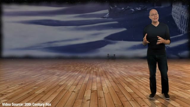Presenter standing before a map of ocean currents