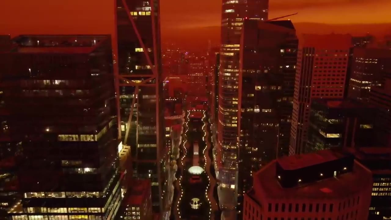San Francisco skyline under an orange wildfire-smoke sky
