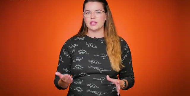 A presenter against an orange background explaining a mission to Europa.