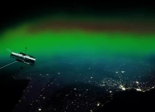 A green aurora above city lights, with a telescope in view.