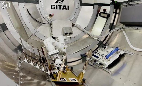 Robot arm assembling hardware inside a cylindrical test chamber