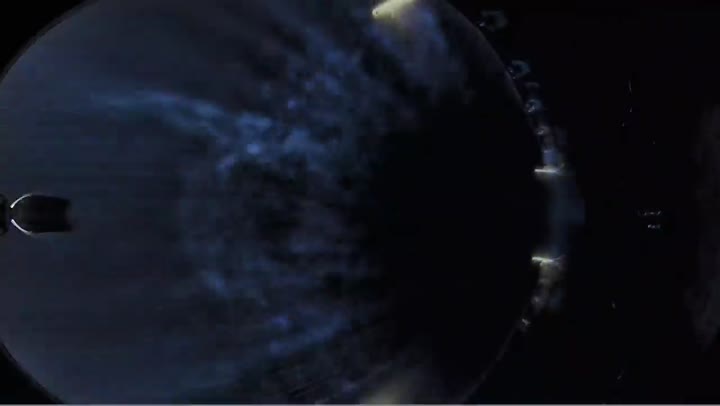 Inside of a payload fairing as it opens in space