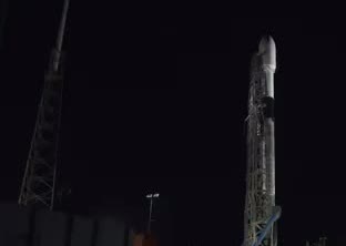 A Falcon 9 on the pad at night