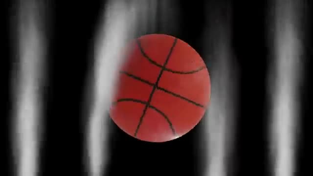 A spinning basketball against dark streaks.