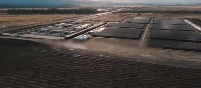 Rows of solar panels at a desert power plant.