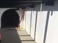 The round mouth of a tunnel.