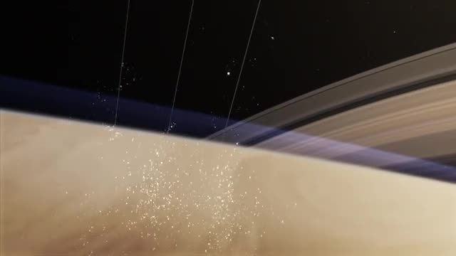 Particles falling from Saturn's rings into the planet.