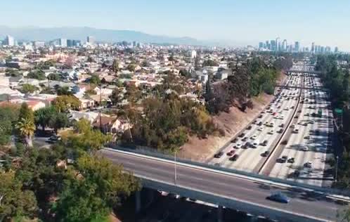 Aerial view of traffic on a multi-lane freeway through Los Angeles
