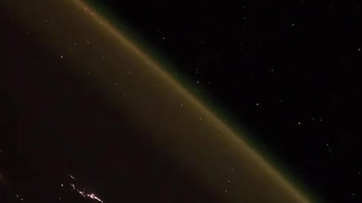 Earth's limb and city lights seen from orbit.