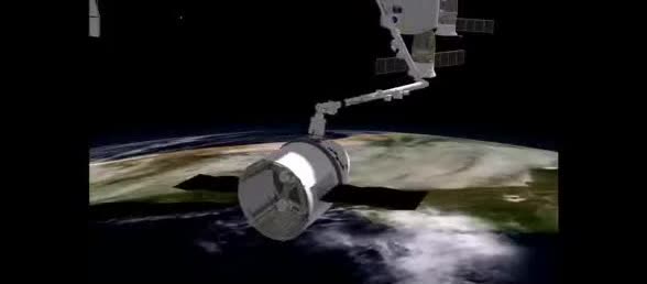 Canadarm2 reaching for a Dragon capsule above Earth