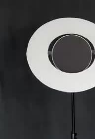 A physical model of a bright ring around a dark black-hole shadow