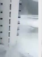A wave hitting an apartment block on Tenerife.