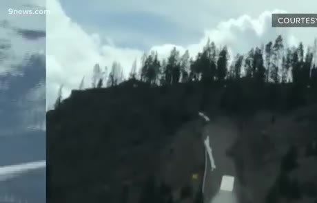 Truck climbing a gravel escape ramp on a mountain road
