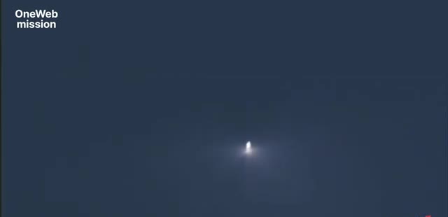 A Falcon rocket seen as a bright point against the night sky while a camera tracks it