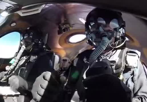 Two pilots in a spaceplane cockpit.
